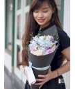 flowers wrapped in cone shaped bouquet
